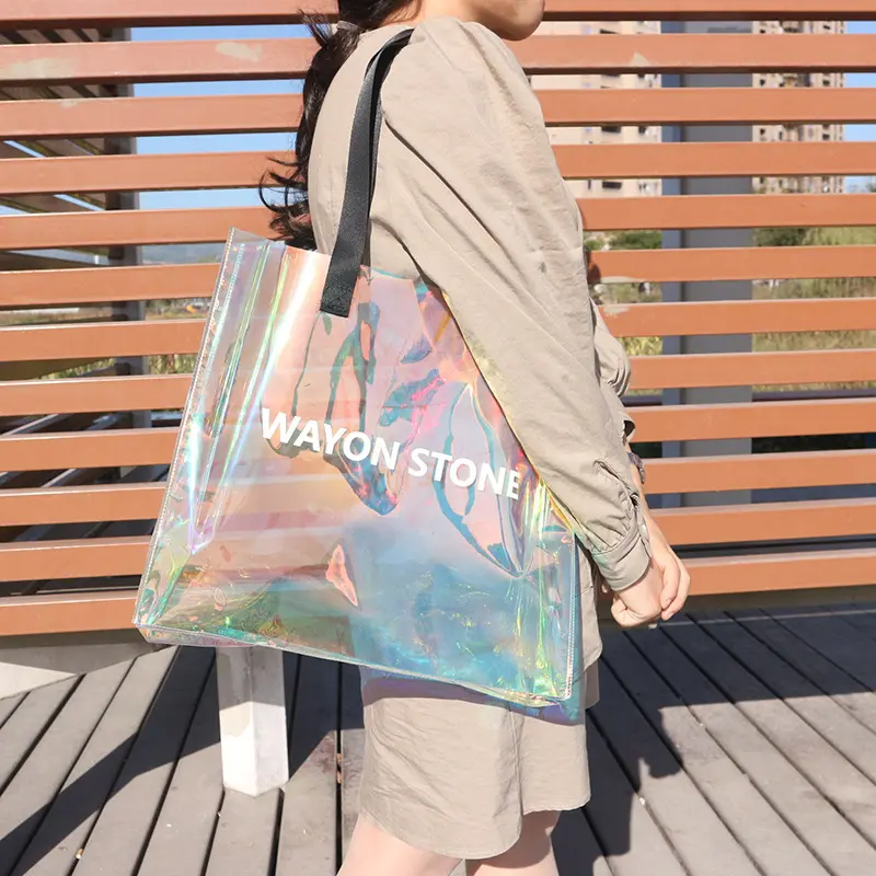 Bolsas transparentes de viaje impermeables personalizadas para mujer, bolso de mano de plástico holográfico, de PVC brillante con láser