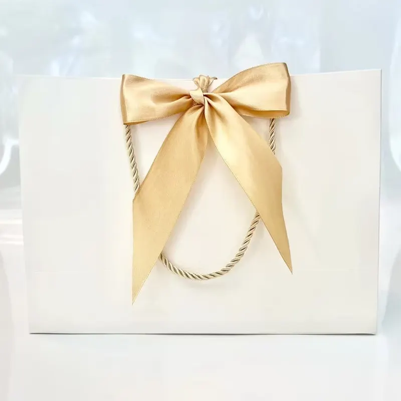 Sacchetti regalo di nozze con fiocco elegante sacchetto regalo bianco corda d'oro manico in corda nastro in oro satinato