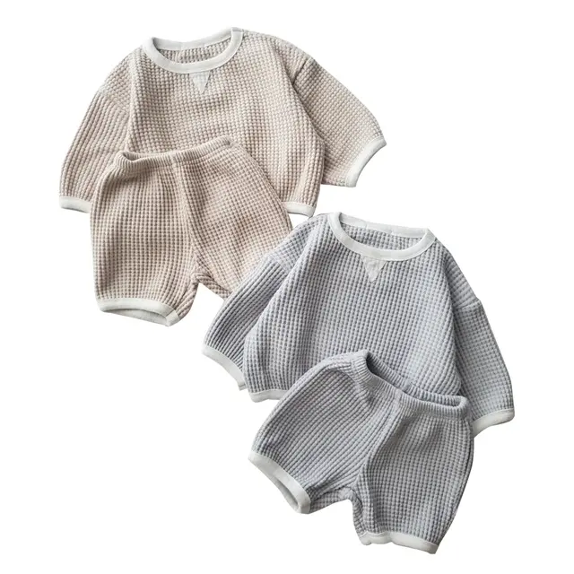 Ensemble gaufré de l'usine de service OEM printemps automne vêtements pour bébés garçons filles ensemble de vêtements short et haut pour tout-petits