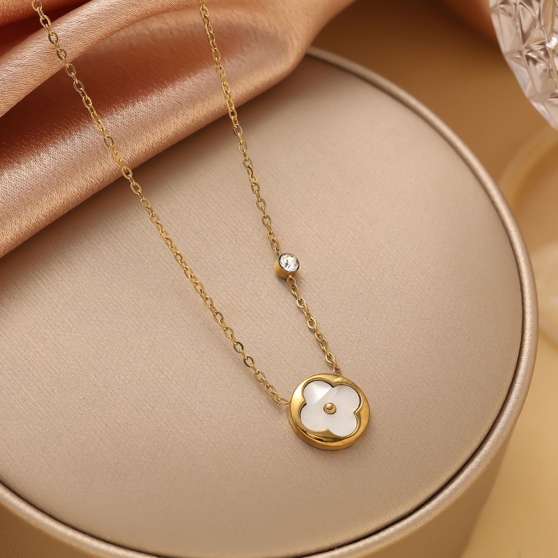 gold four clover with shell