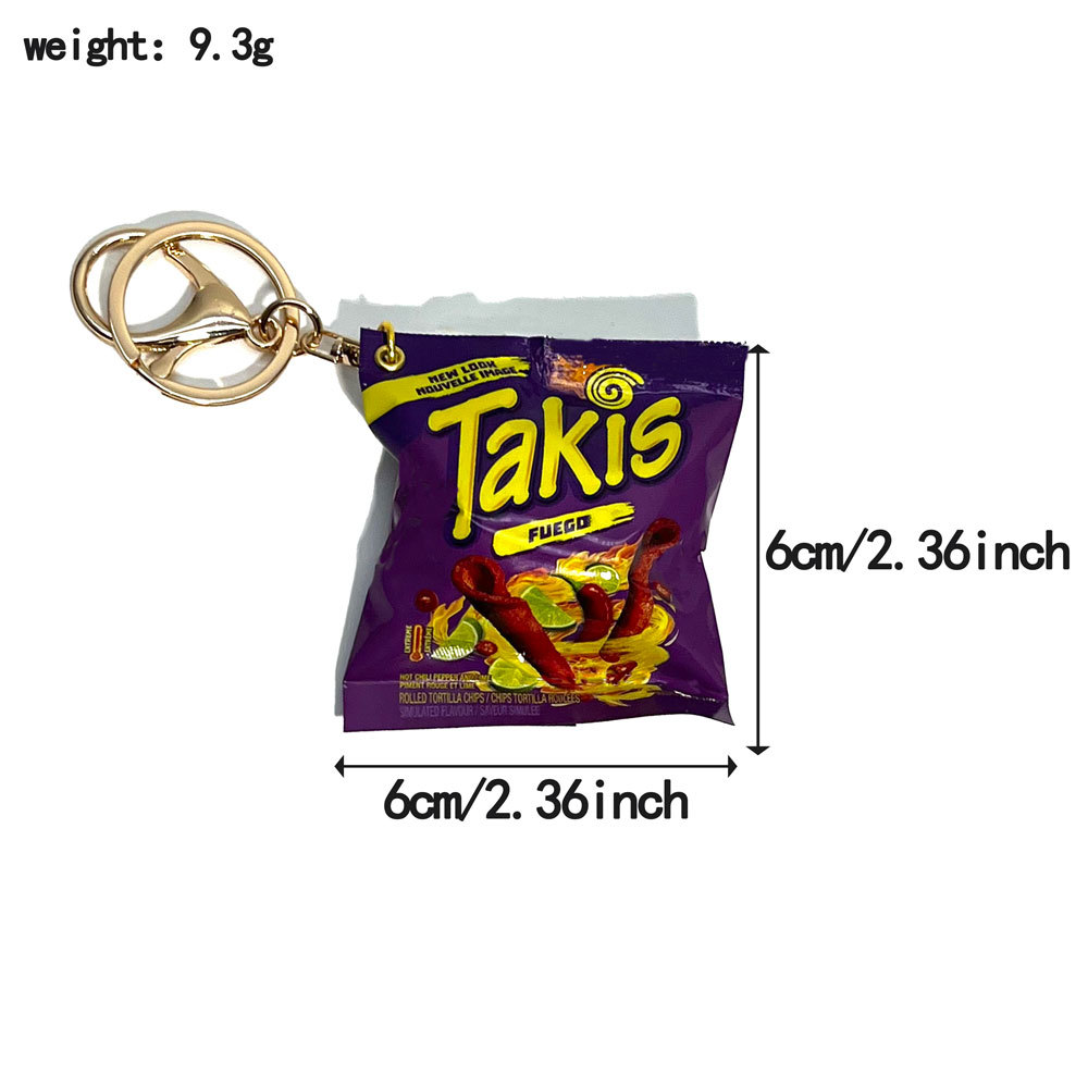 Bolsa de snacks Ta con hebilla morado-dorada.