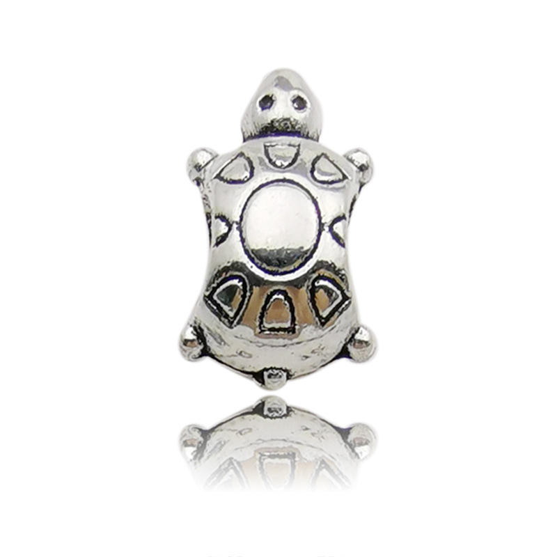 1 large hole bead of Marine turtle 9x9x14- holes 4