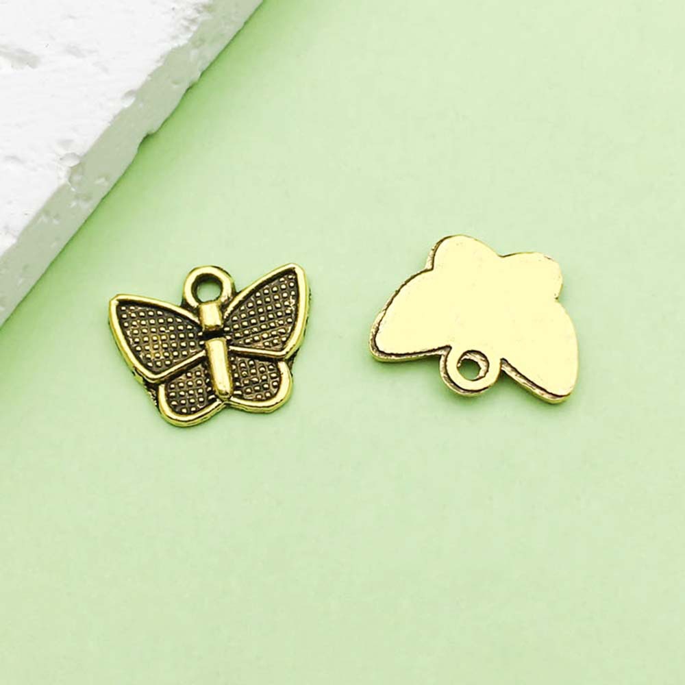 Un papillon antique en or - 0,4g - 12*10mm - 11079