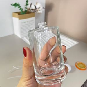 Özelleştirilmiş yüksek kaliteli ambalaj 30ml 50ml 100ml silindirik şeffaf cam örnek şişesi parfüm - Product Image 1