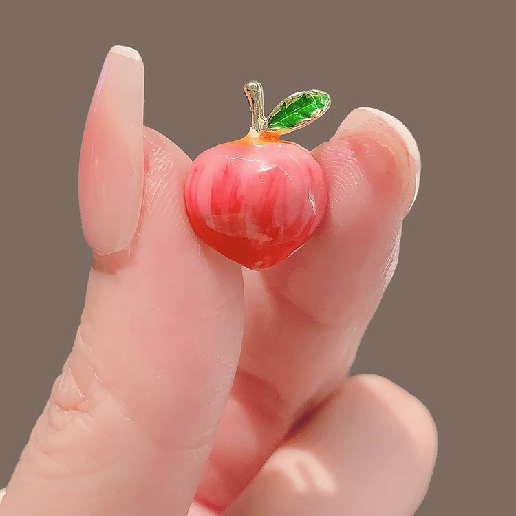 Peach-shaped brooch
