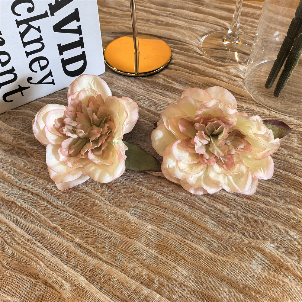 Pair of white peony shoe clip with pink edge