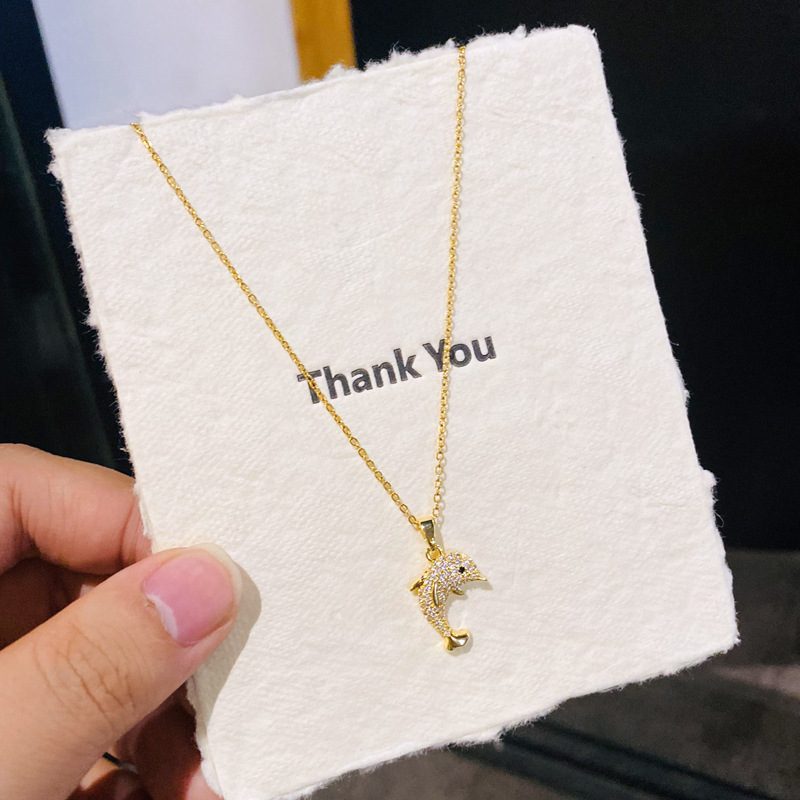 D15 gold-colored-fully diamond-encrusted little dolphin