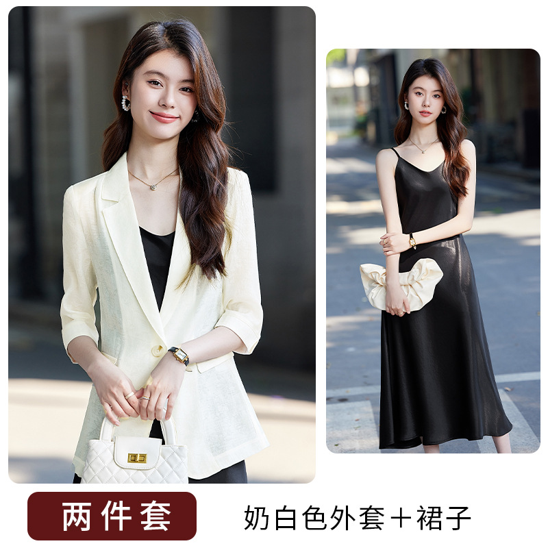 Off-white suit and black dress