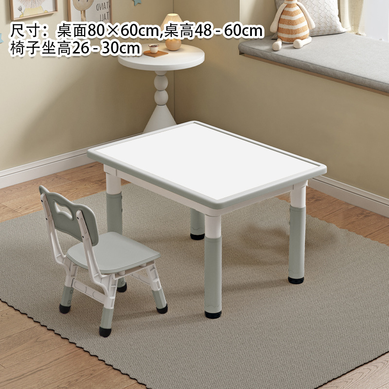 Tableau blanc, table et chaise grises