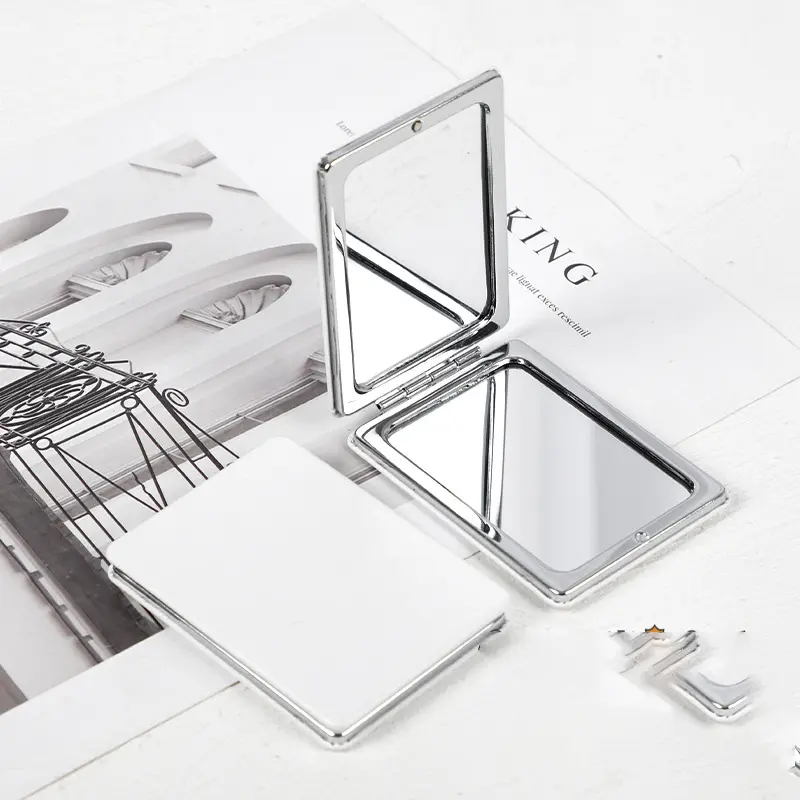 กระจกกระเป๋าพับได้ทำจากหนังสีขาวของขวัญสำหรับเด็กกระจกขนาดเล็กสุดสร้างสรรค์สำหรับโฆษณา