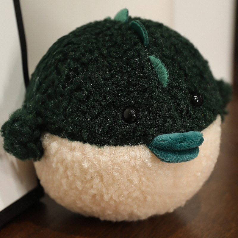 Peluche verde a forma di pesciolino palla