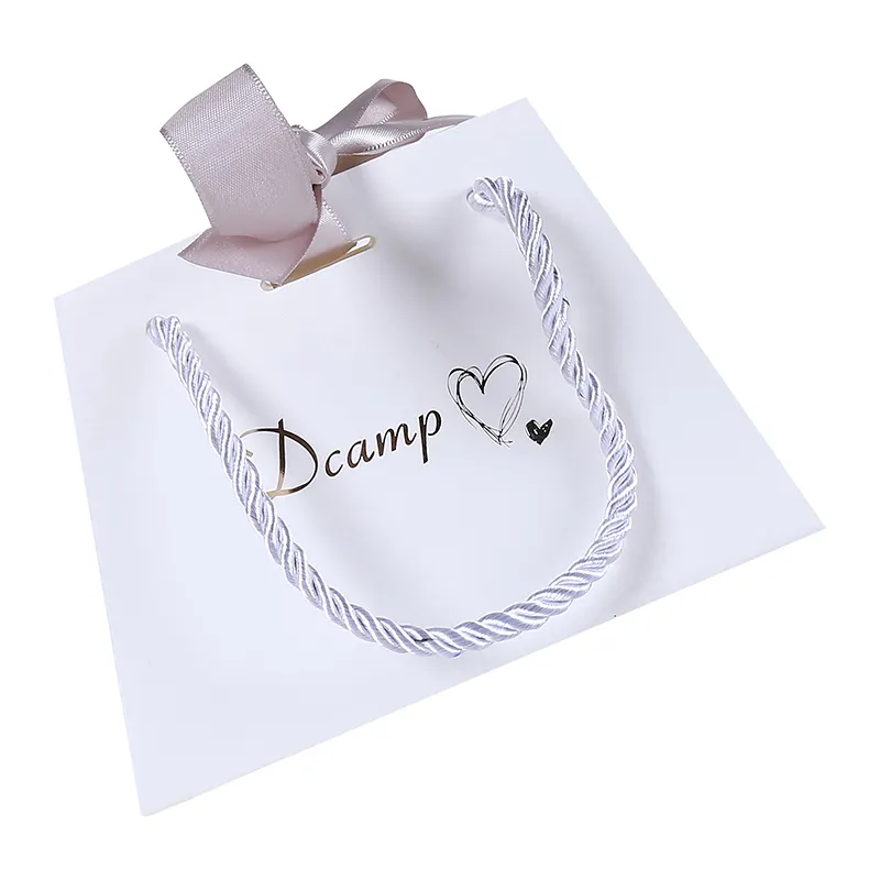 Bolsa de papel reciclable al por mayor bolsas de papel de lujo con logotipo personalizado y caja para ropa embalaje de joyería
