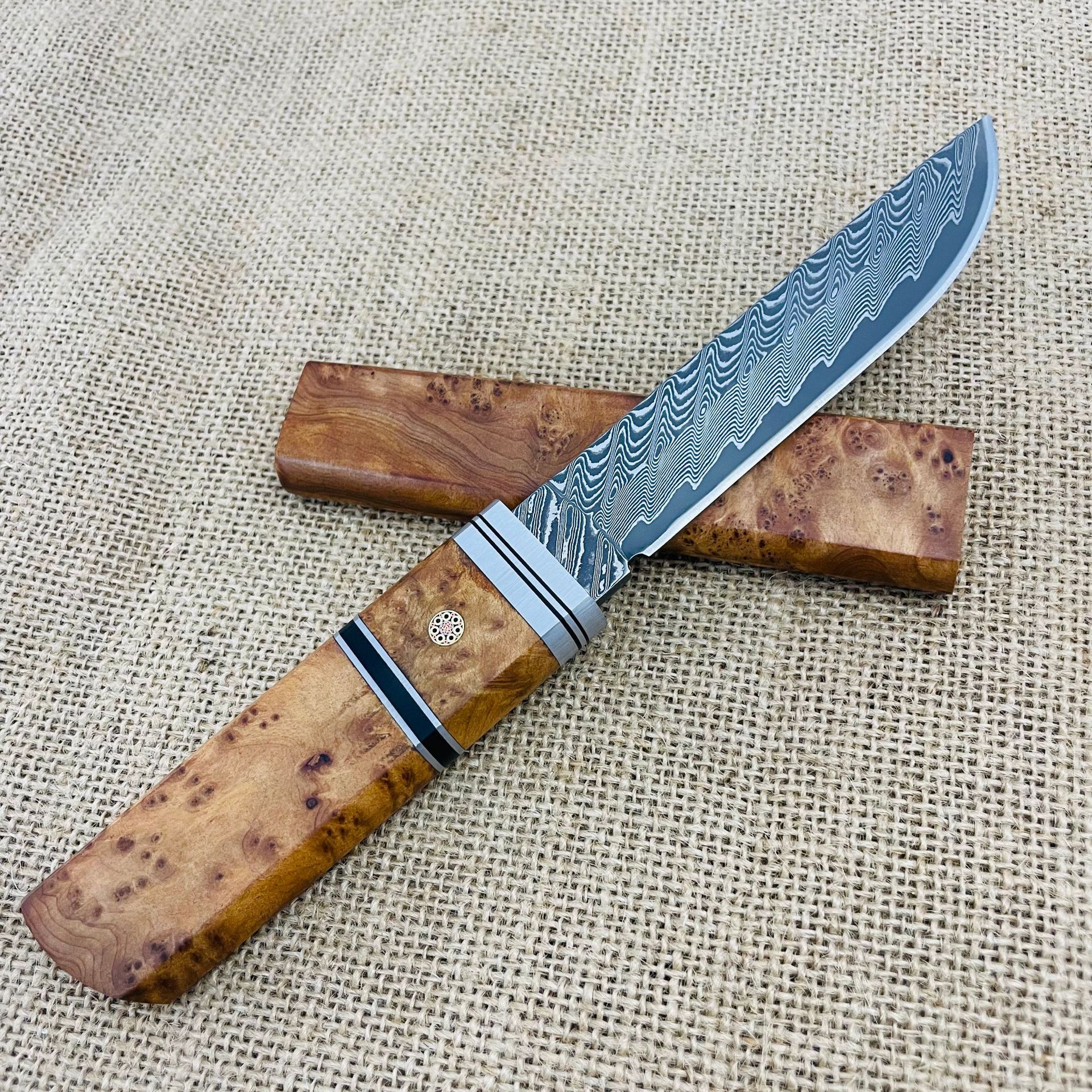 Manche en érable figuré