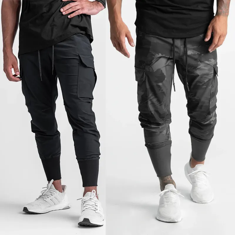 Pantalones Cargo con bolsillos laterales para hombre, calzas de Fitness personalizadas, color gris, caqui y negro