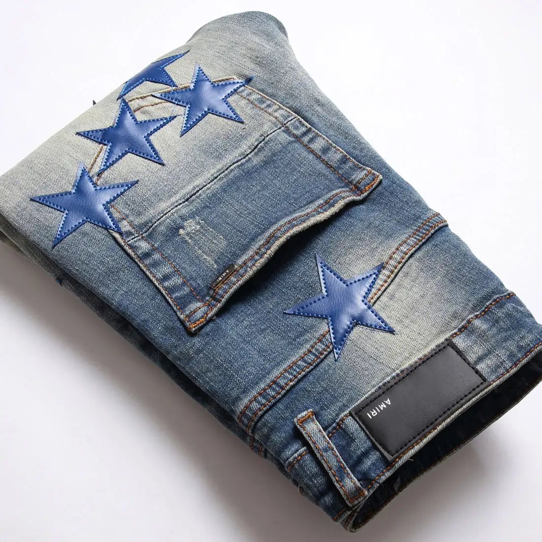 Hochwertige benutzer definierte Herren Jeans High Street neue zerrissene blaue Stern Patch schlanke Füße voller Sterne Stretch Denim zerrissene Jeans