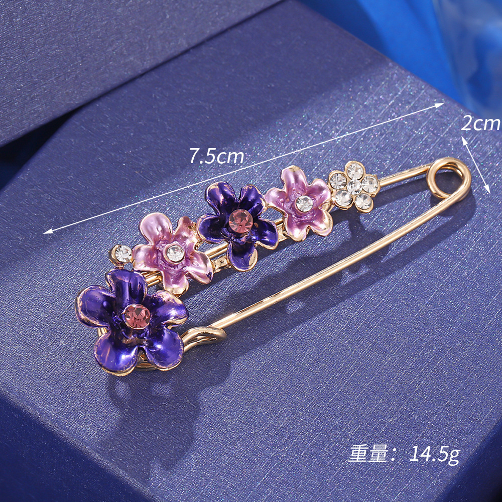 Broche de flor morada