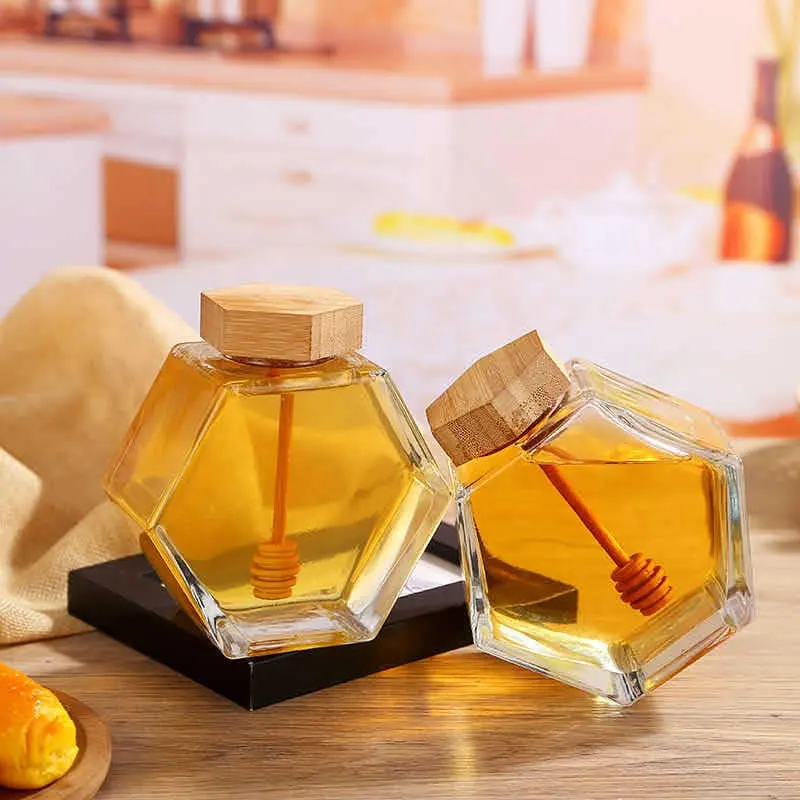En gros clair logo personnalisé stockage pot de miel louche récipient vide pot de miel en verre hexagone pots en forme de miel avec couvercle