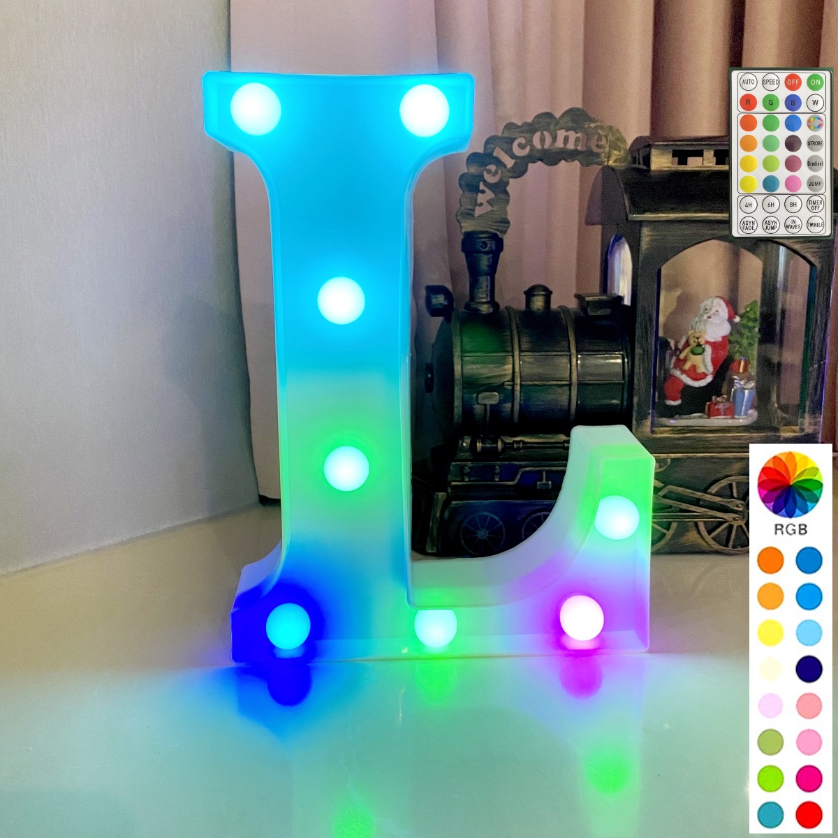 Lettre colorée synchronisée avec télécommande sur fond blanc : l