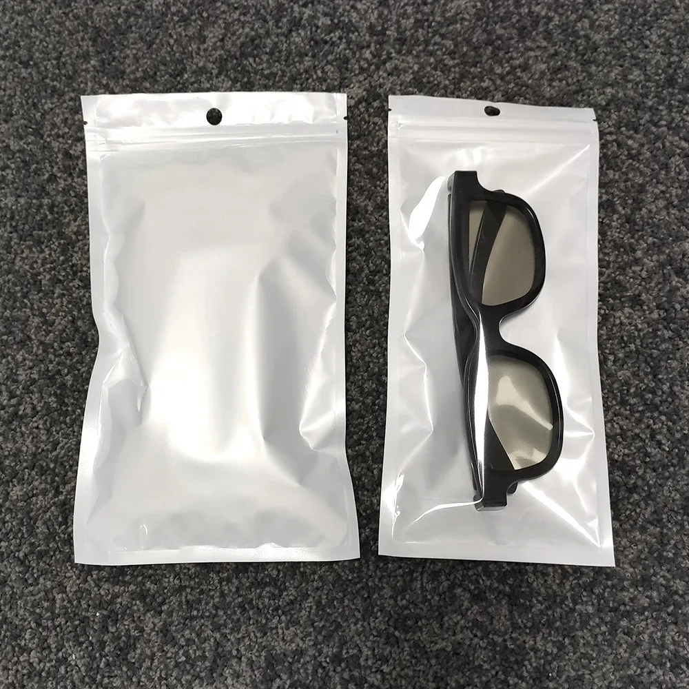 Bolsa con cremallera de perla blanca Paquete de material de película Bolsa con cierre hermético para auriculares translúcidos con orificio para colgar