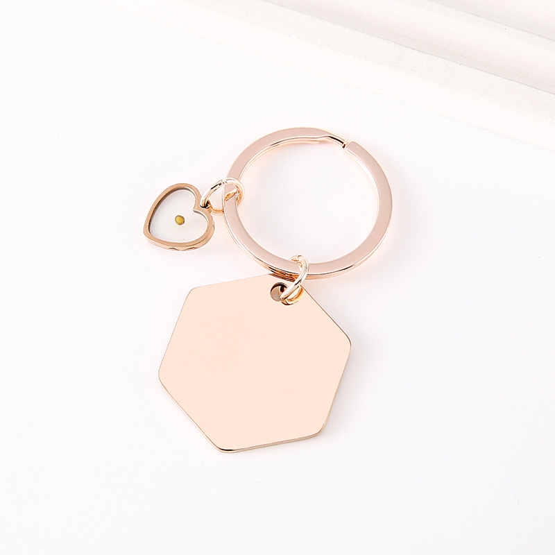 Corazón hexagonal de oro rosa con colza.