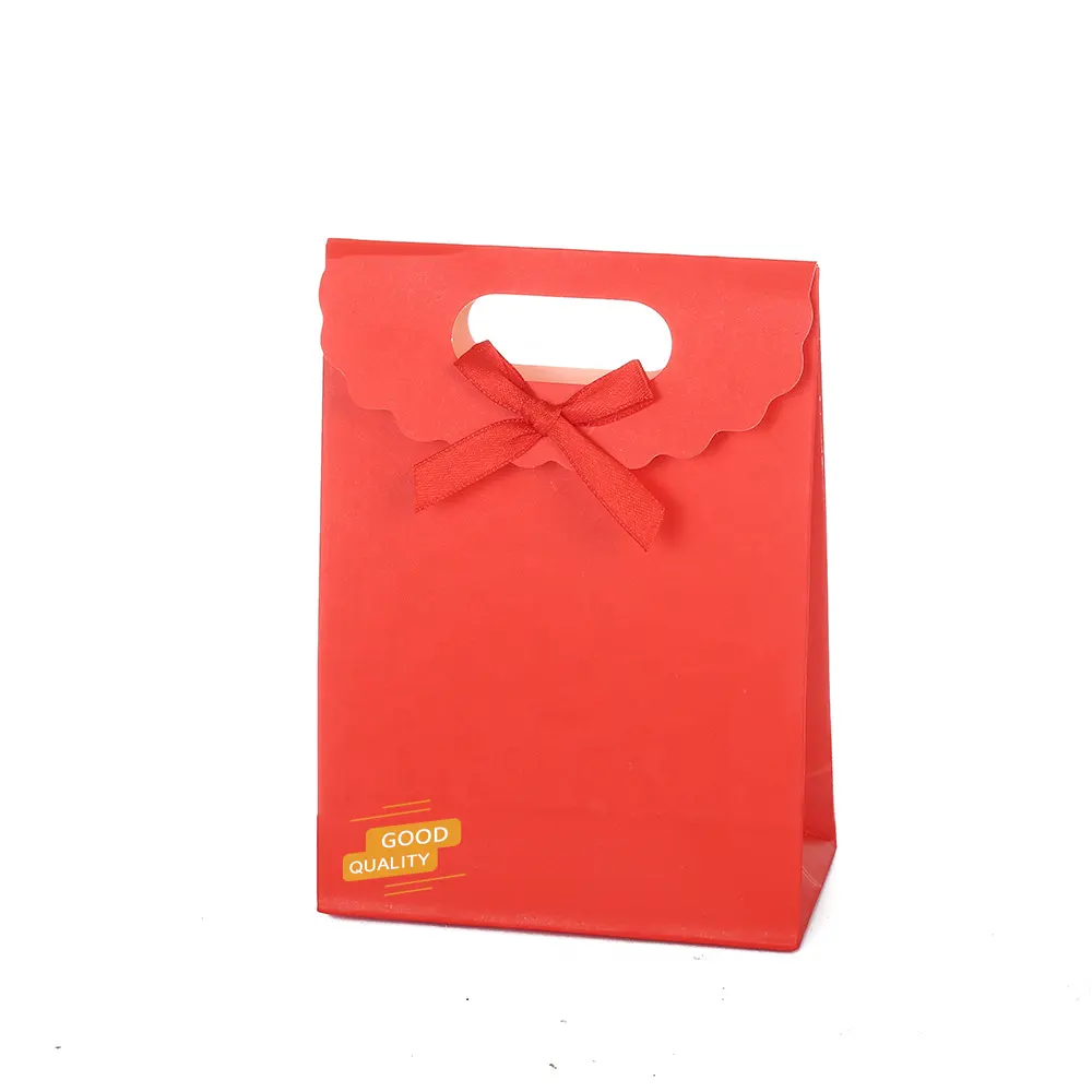 カスタムブランドの小売ブティック蝶結び子供の誕生日の結婚式のためのグログランリボンハンドル付きの安いカラフルな紙のギフトバッグ