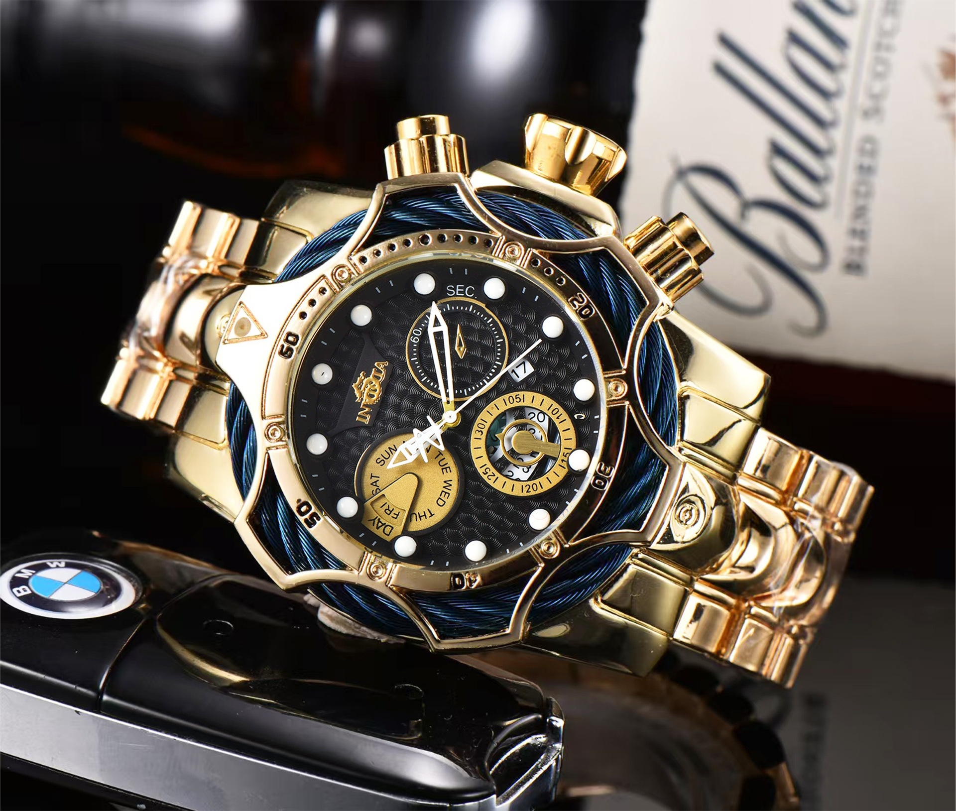 Gold case-blue strap-black dial
