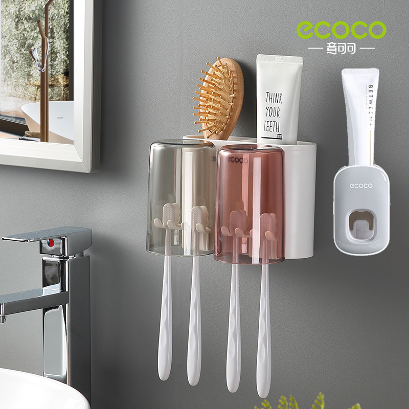 Two cups of toothpaste squeezer, gray and white