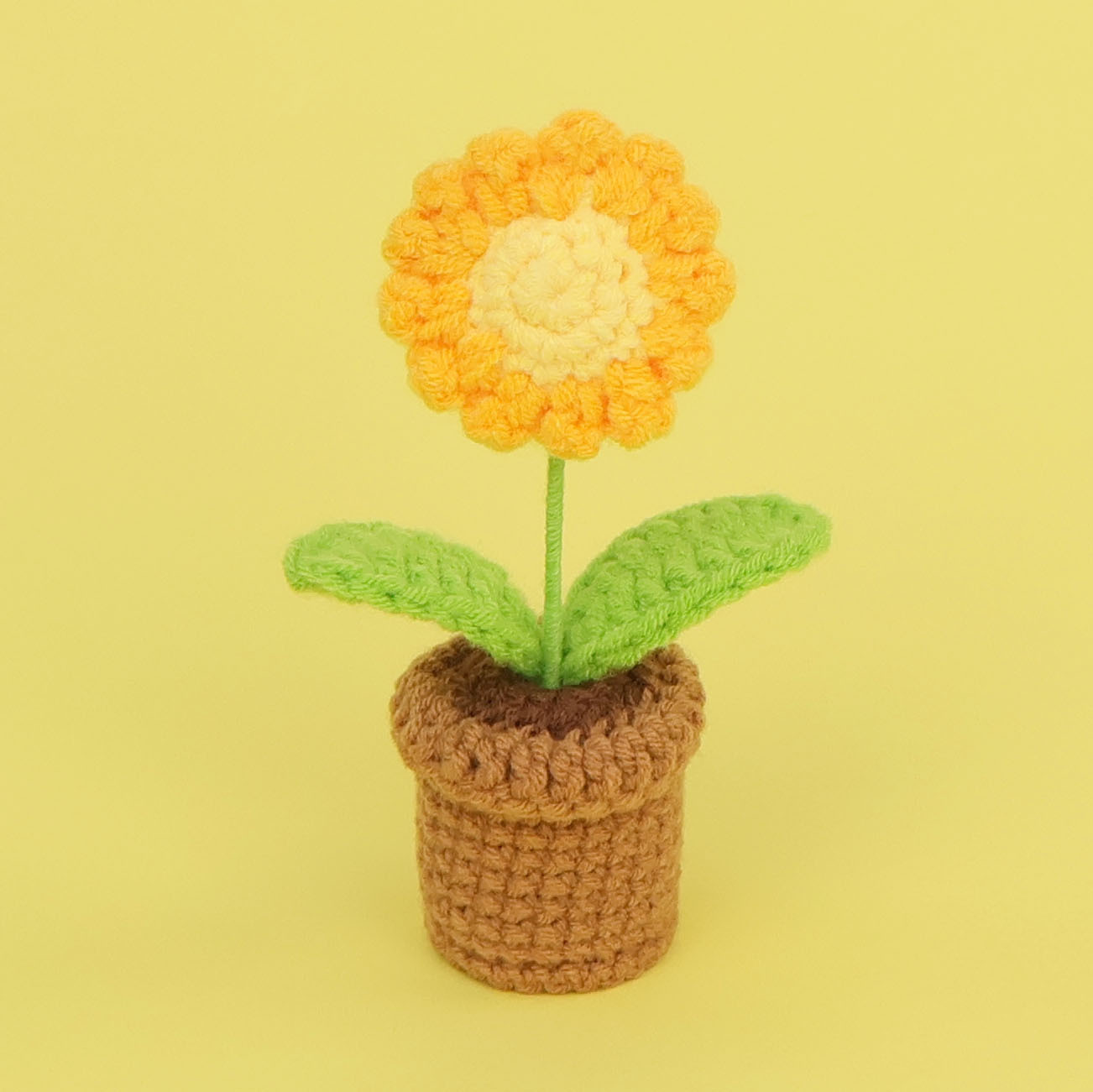 Bassin en laine super mini, motif marguerite jaune.
