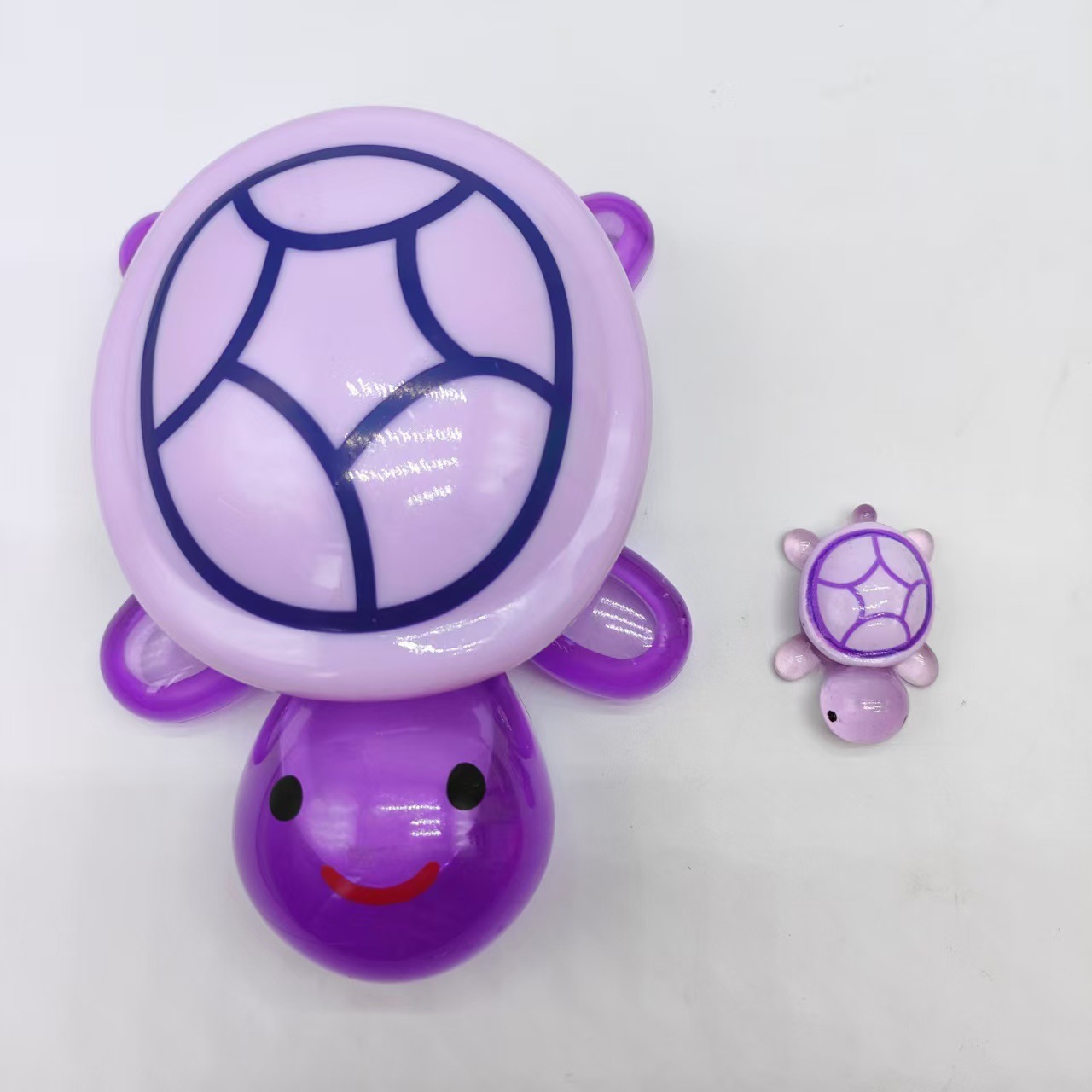 A 17-cm purple turtle with an open lid