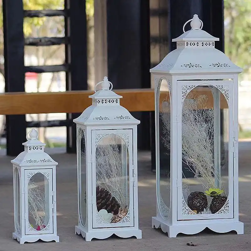 Linternas de vela de cristal de hierro grandes europeas al por mayor linterna de candelabro de metal blanco para decoración interior y exterior de hotel en casa