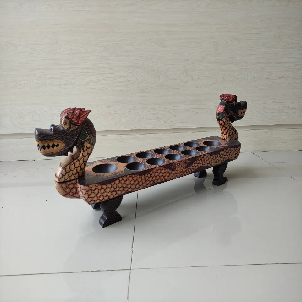 Set di Mancala in legno di giavanese fatto a mano con motivo a drago serie intagliare motivi di pittura Batik prezzo all'ingrosso origine Indonesia