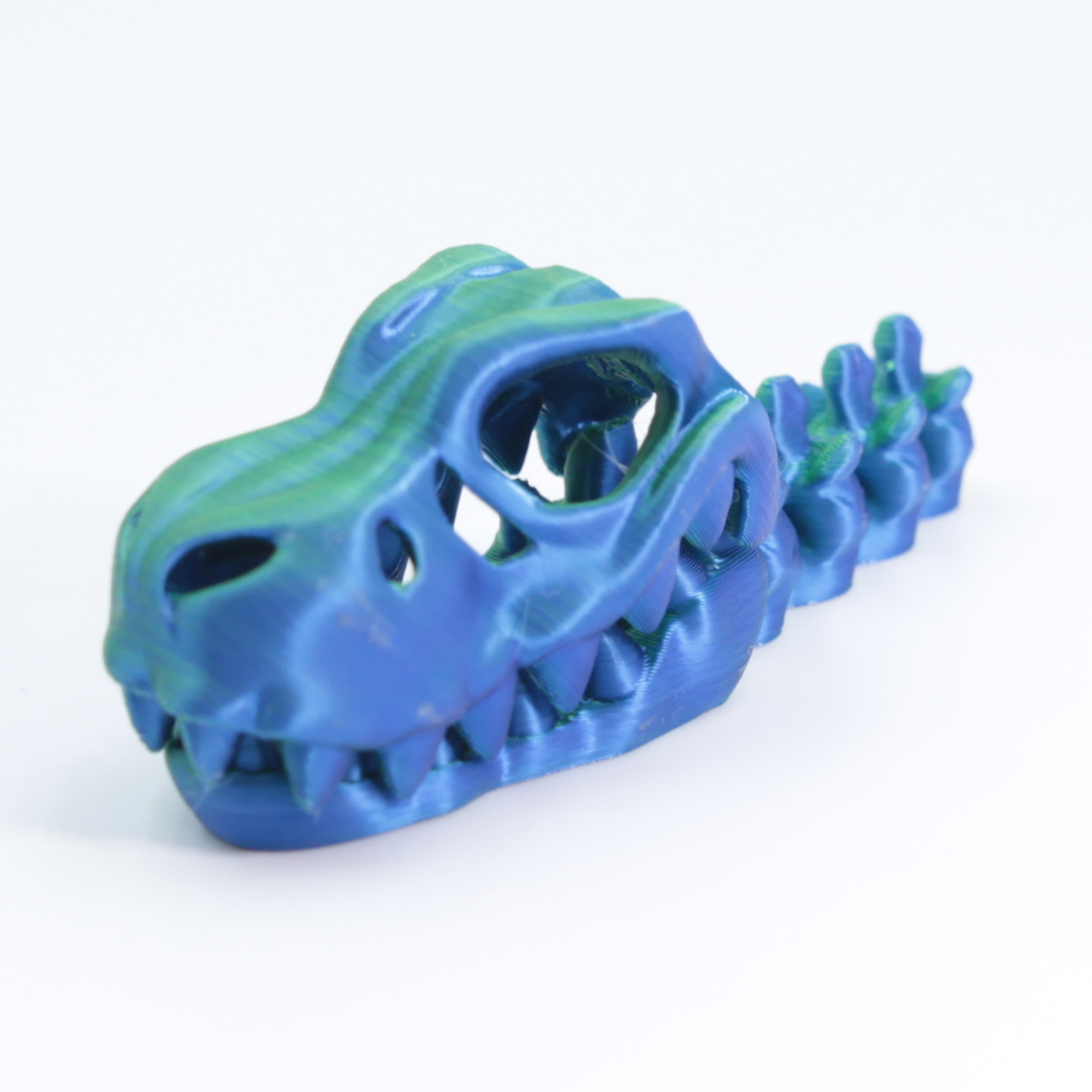 Colgante tiranosaurio azul-verde de 9cm
