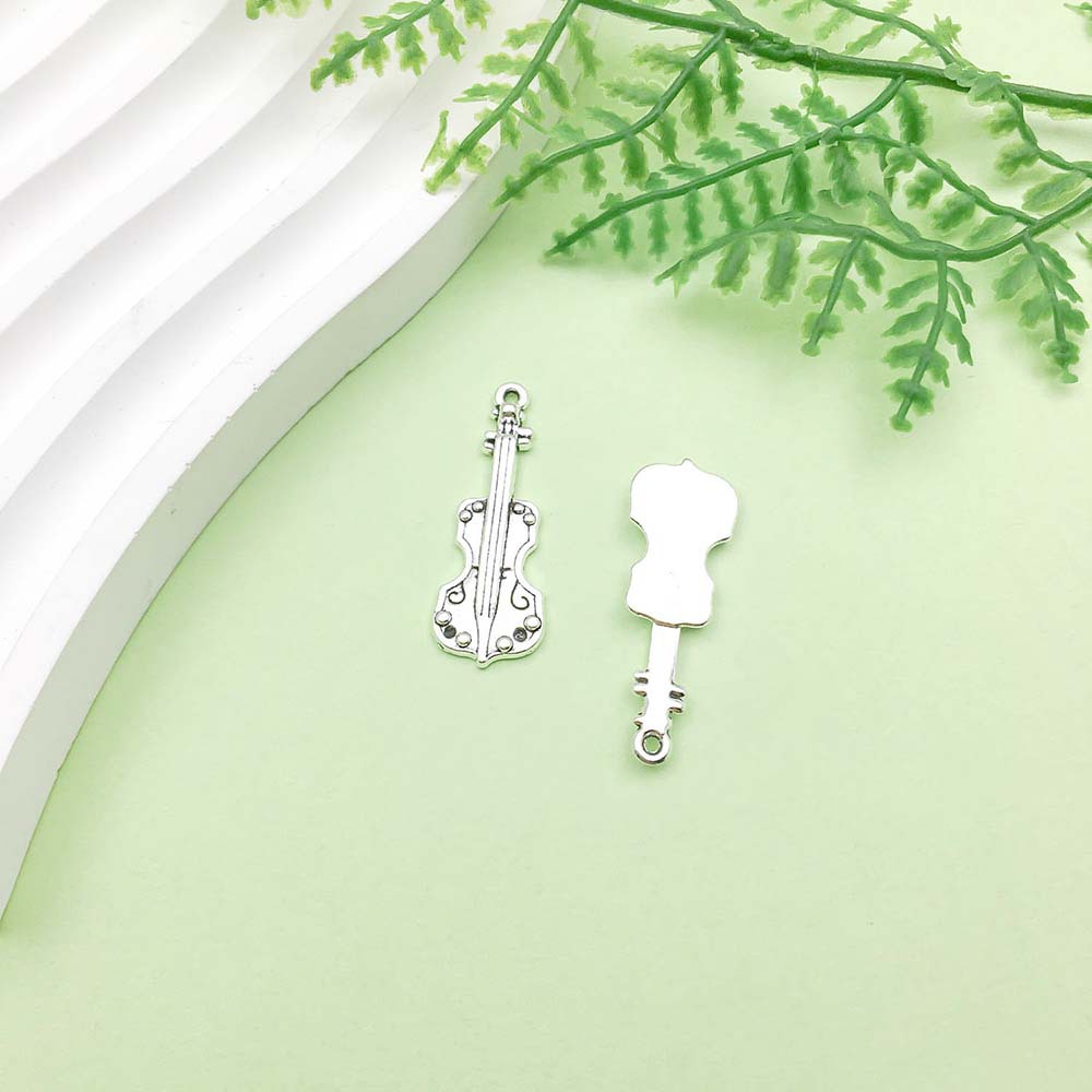 1 guitare argent antique - 2,5g - 11*32mm - 5808