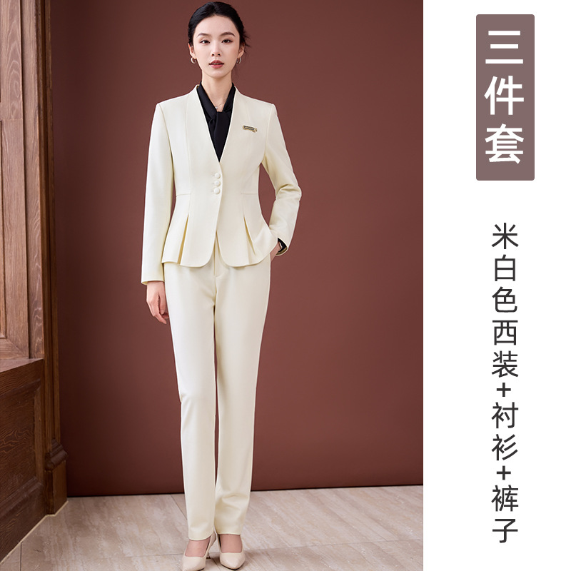 off-white suit, black shirt and trousers