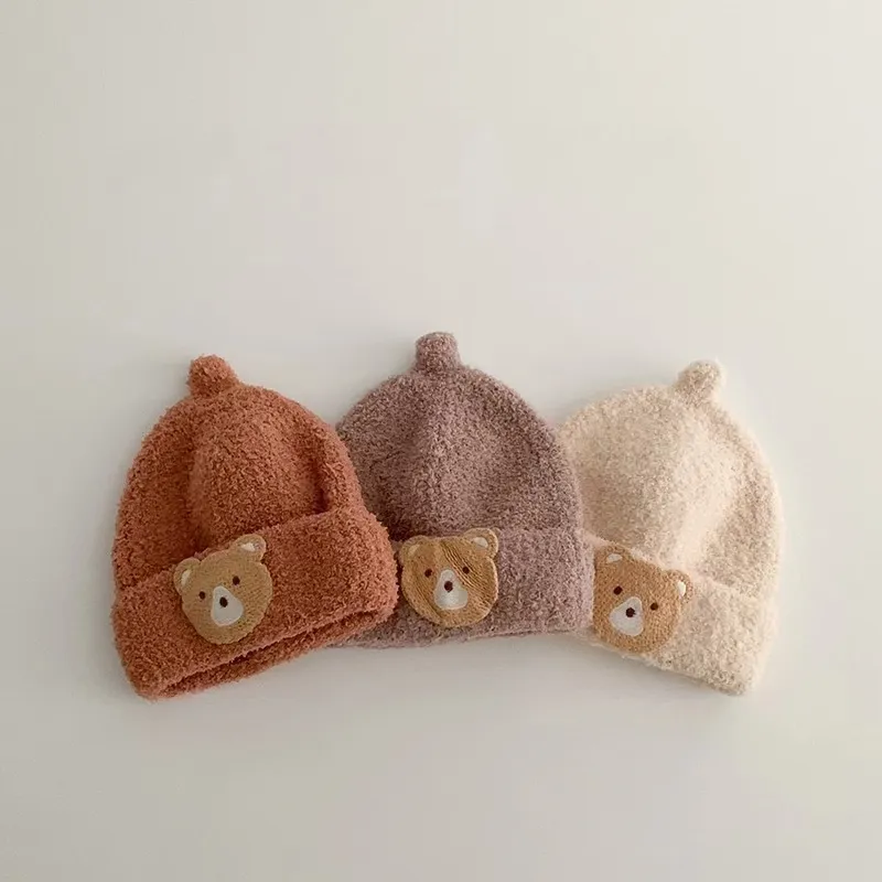 หมวกถักสีพื้นสำหรับเด็กฤดูใบไม้ร่วงและฤดูหนาวหมวกบีนนี่หมวกหมีอบอุ่นแบบลำลอง
