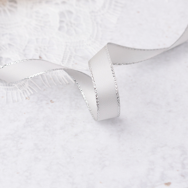 One meter of silver-edged gray ribbon