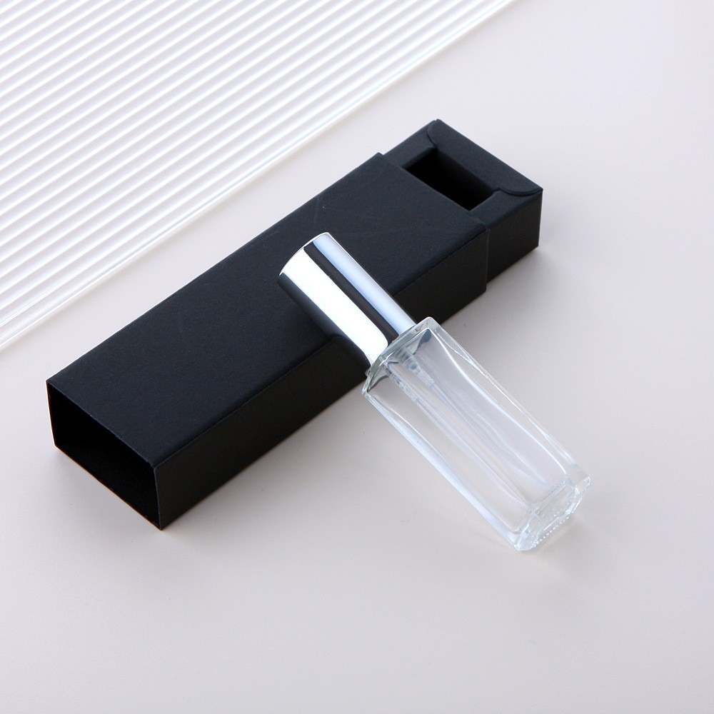 Botella pulverizadora de vidrio transparente + tapa plateada + caja negra
