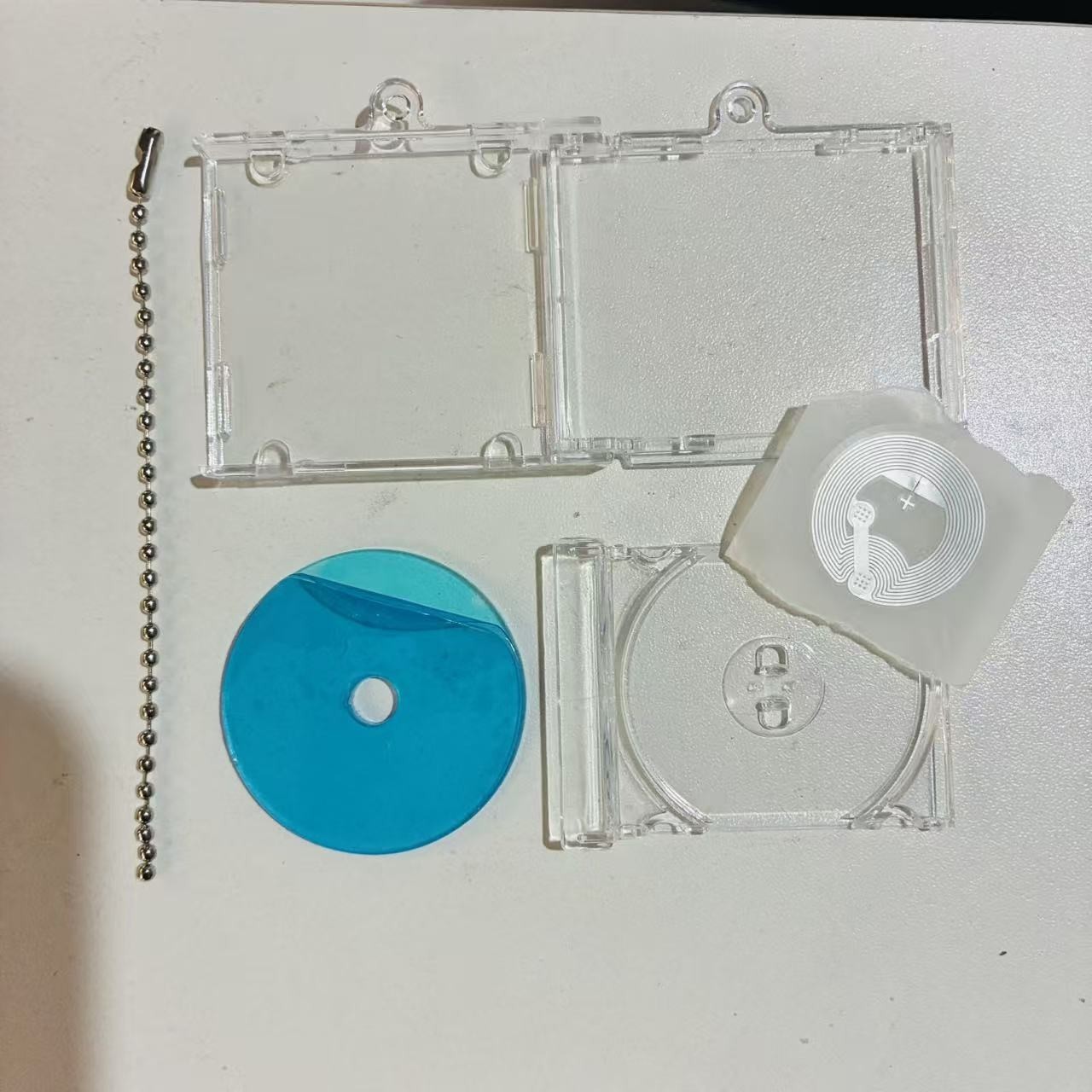 Empty box+laser CD+bead chain+NFC
