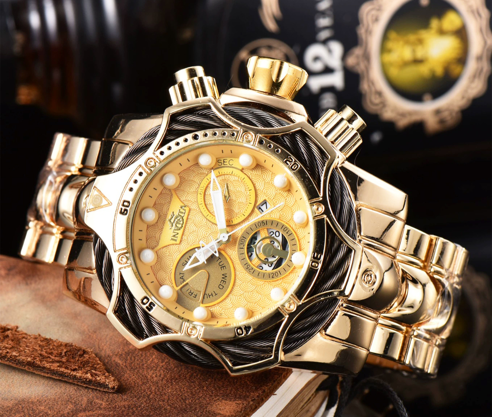 Gold case-black strap-gold dial
