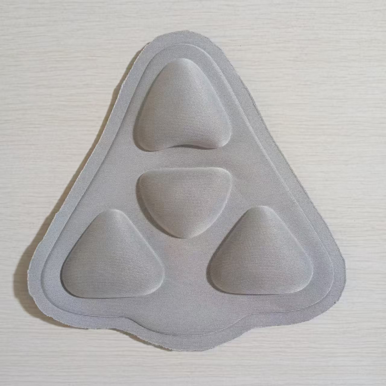 Coussin triangulaire