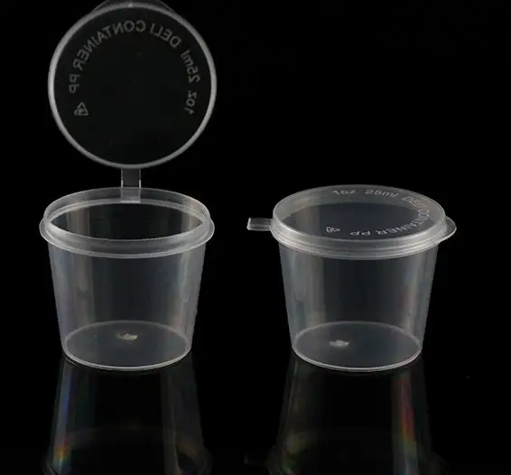 small round plastic container for sauce