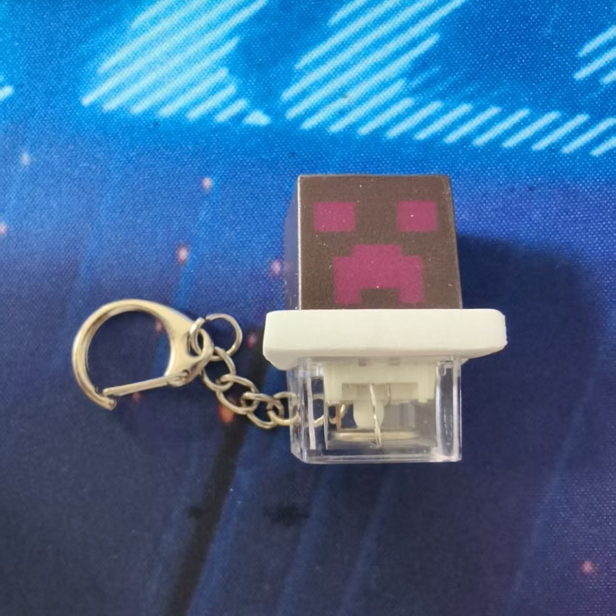 Black-purple cube, illuminated button, transparent base