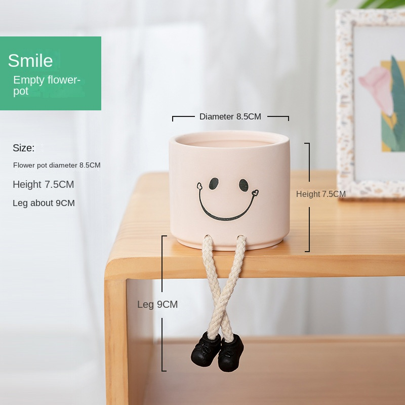 Espressione sorridente Piedi appesi Vaso di fiori vuoto