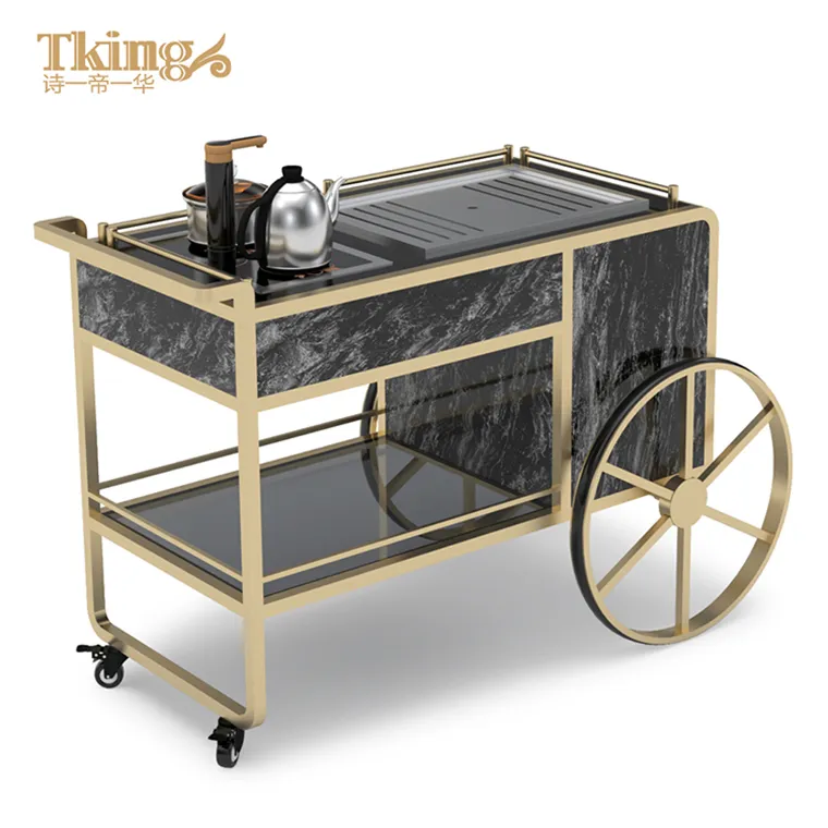 I fornitori cinesi usano l'auto di servizio del carrello del tè dell'acciaio inossidabile dell'oro champagne per il banchetto