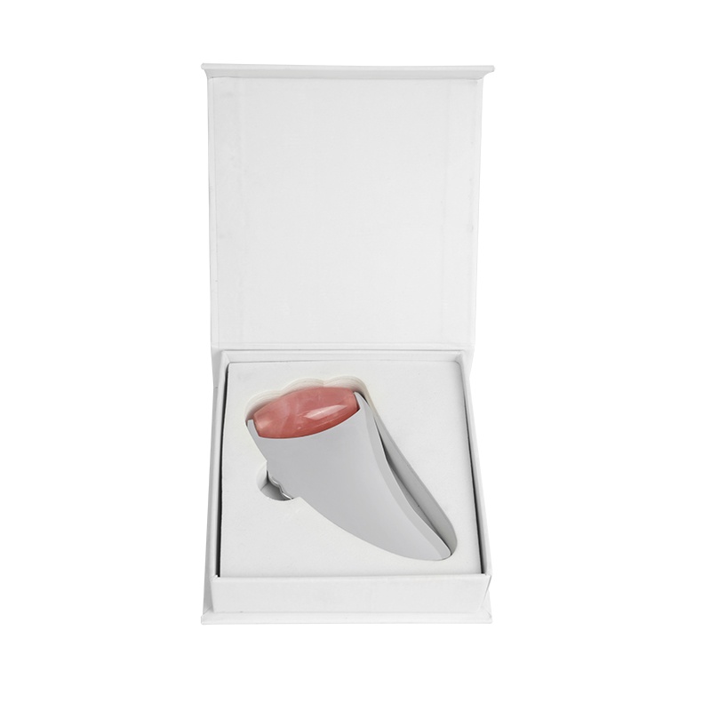 Gua sha avec boîte magnétique blanche à clapet.