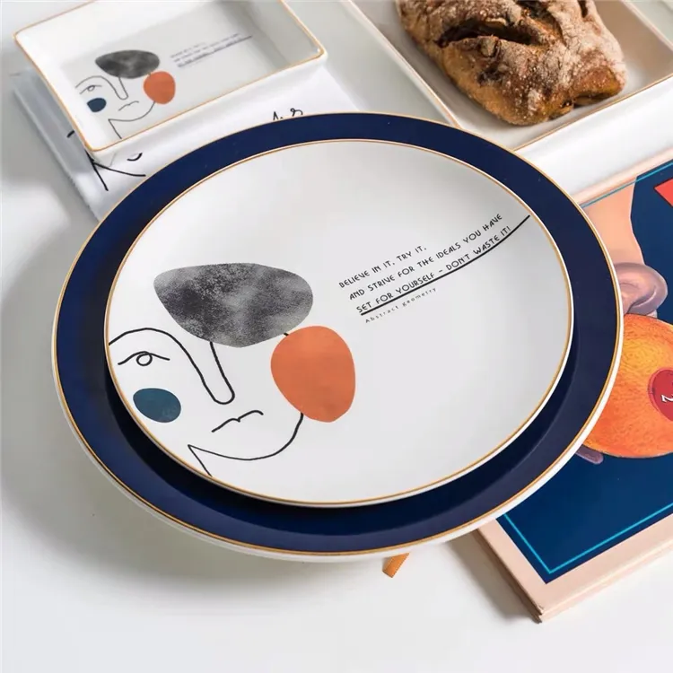 Il nuovo disegno della novità personalizzato decal stampato artistico astratta commercio all'ingrosso bianco cena piatti in ceramica con bordo in oro