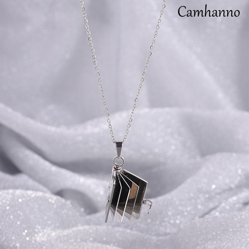Silver erotic book necklace