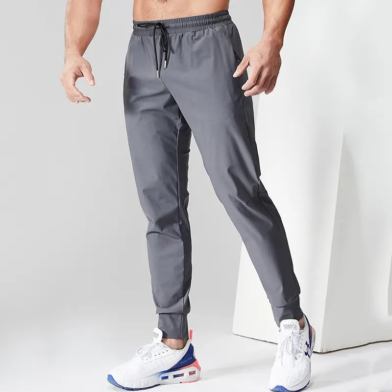 Pantalones de chándal de nailon para correr en blanco elástico para hombre, pantalones transpirables para correr en el gimnasio para hombre