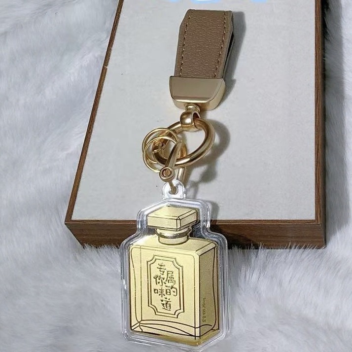 Flacon de parfum (contenant 20mg d'or - cordon marron)