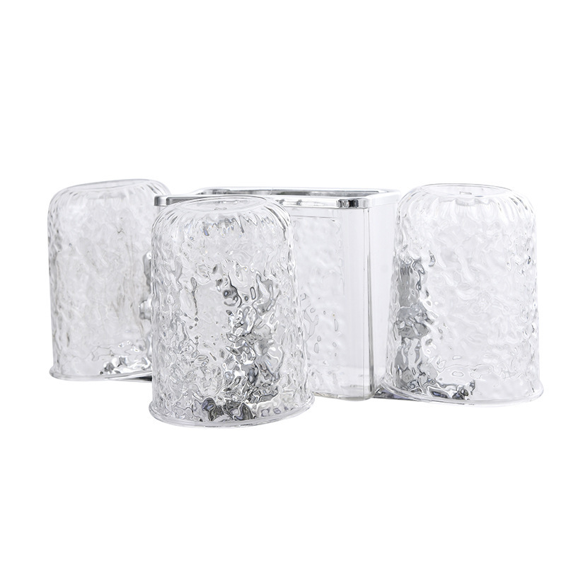 A family of three with a transparent white travel cup ring